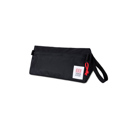 3/4 front product shot of Topo Designs Dopp Kit in "Black".