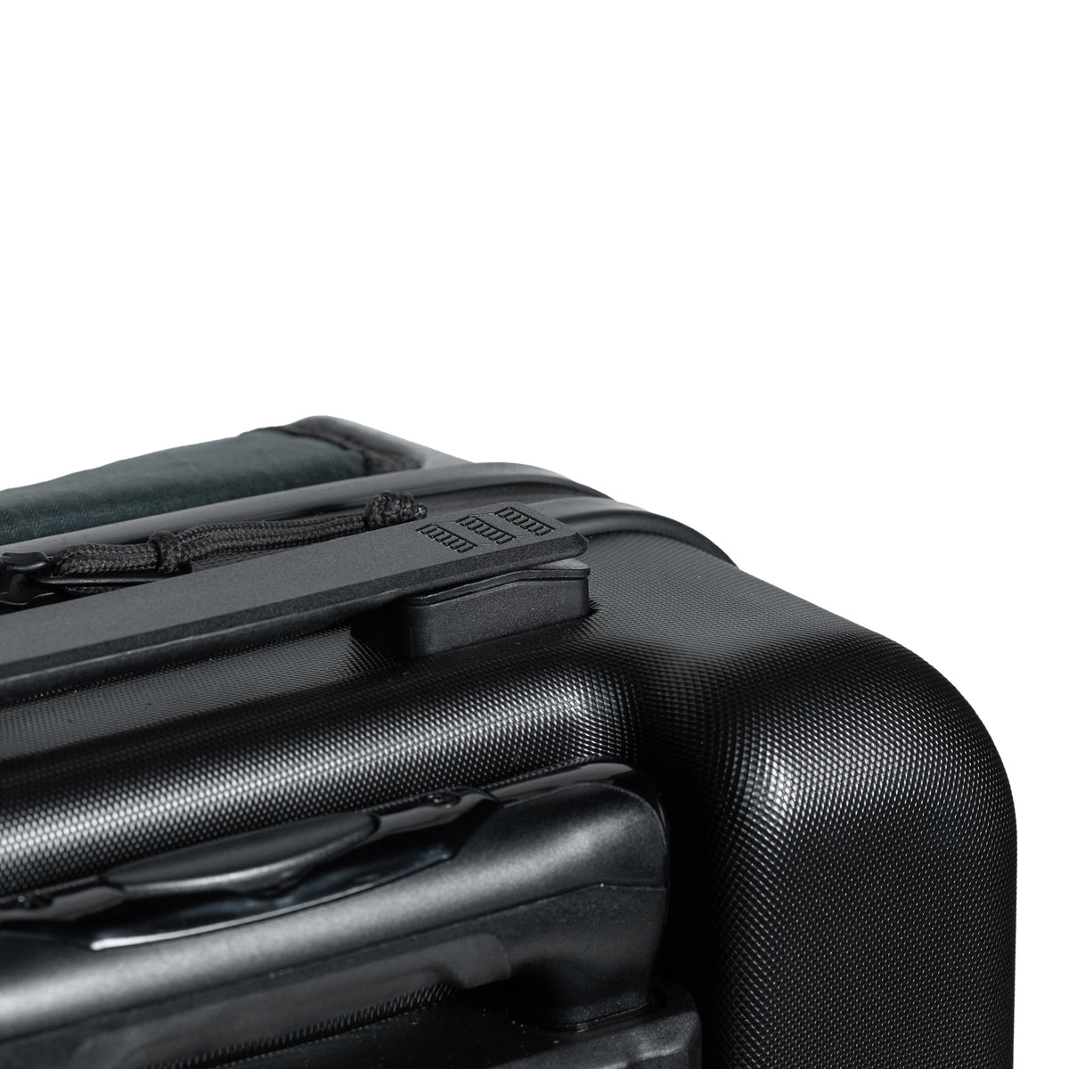 General top handle detail shot of Topo Designs Global Pro Travel Roller Bag